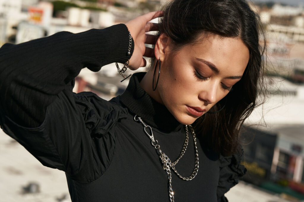 Kylee Dashefsky styled on a DTLA rooftop against the city skyline, contemporary editorial portrait photography