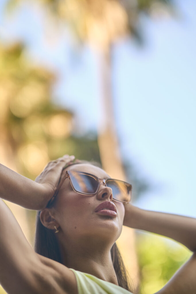 Stephanie Murone in Gentle Monster eyewear posing poolside at a Silver Lake home, fashion campaign portrait