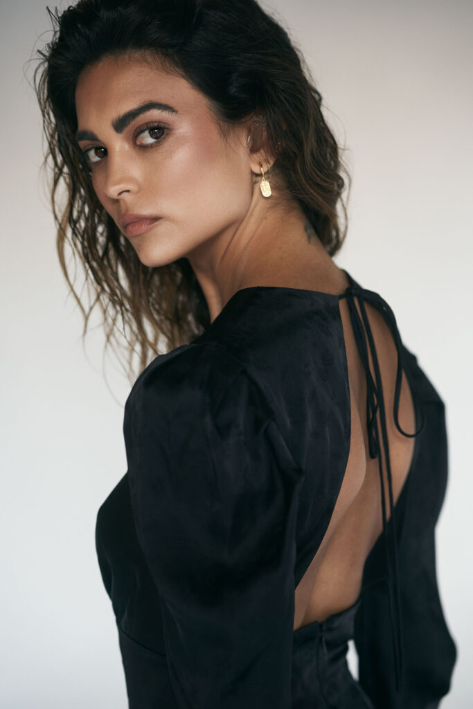 Model Kyra Santoro styled for Altuzarra Fall/Winter campaign in dramatic high-contrast studio light, fashion shoot