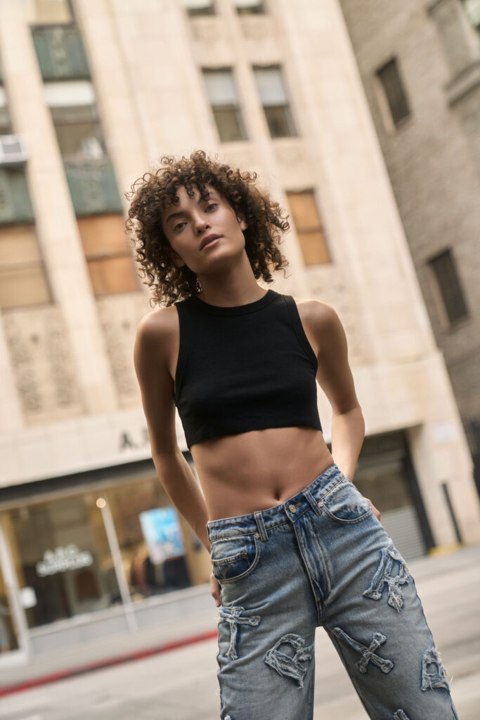 Ceairra Perez for Racer Worldwide against the Downtown Los Angeles cityscape, campaign fashion photography