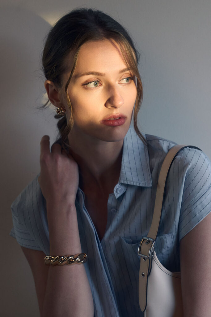 Anna Hodsdon captured in dramatic creative lighting for The Workshop lookbook, studio portrait shoot